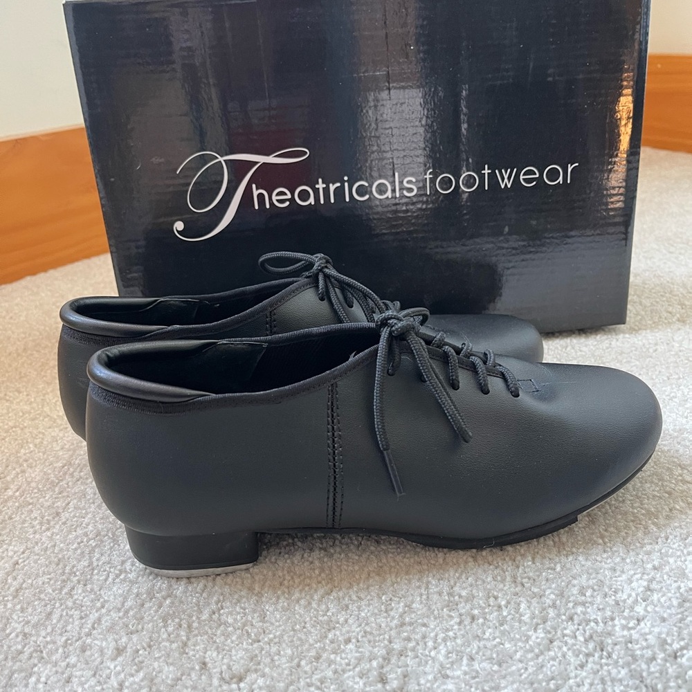Theatrical footwear tap shoes.